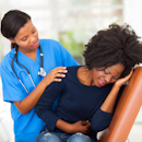 Nurse comforting patient with gastrointestinal issues Nurse comforting patient with gastrointestinal issues