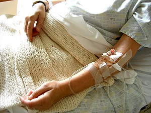 Patient with an IV in their arm Patient with an IV in their arm