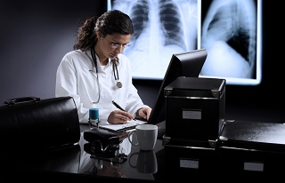 Physician writing a prescription for a patient Physician writing a prescription for a patient