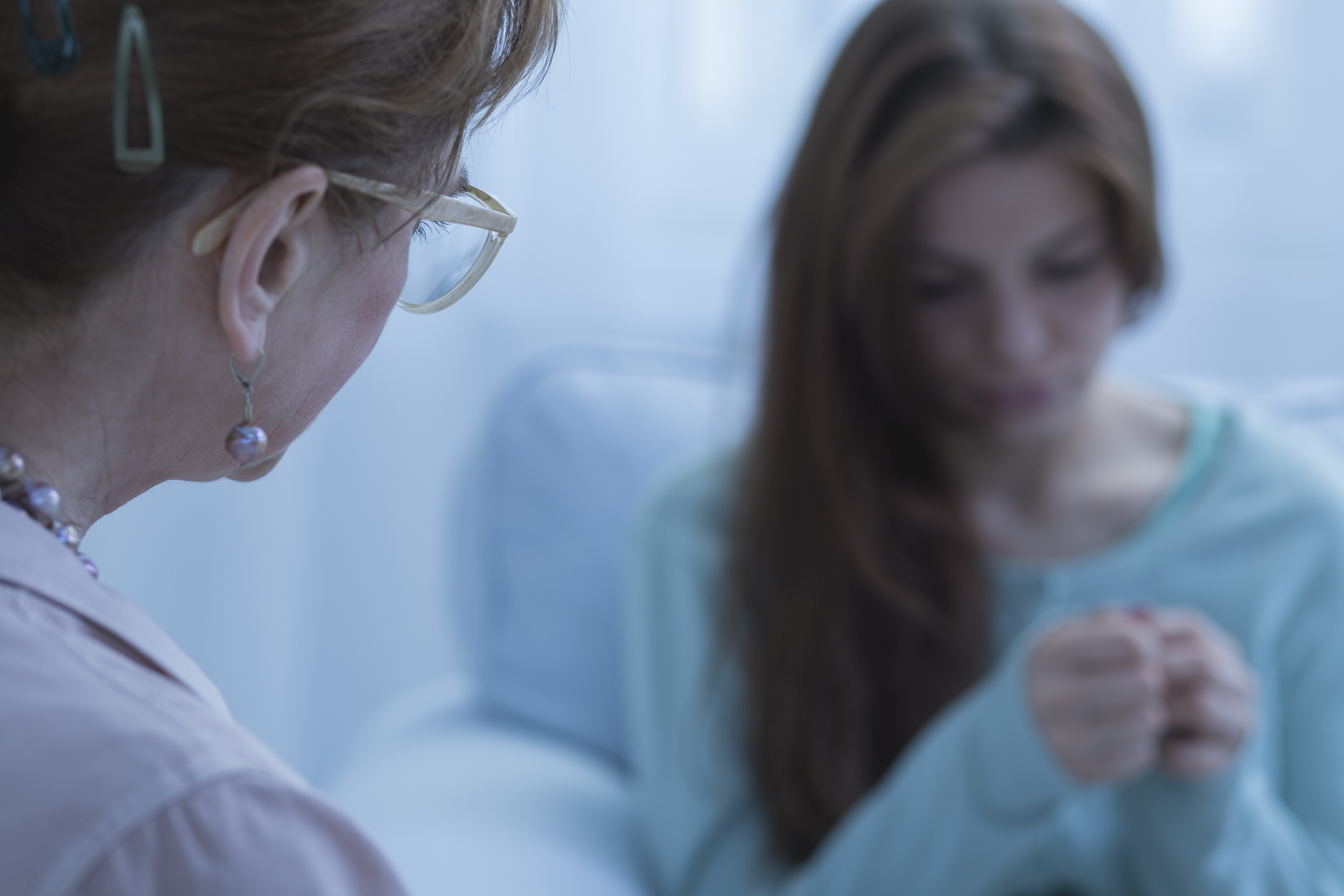 Nurse talking to a patient struggling with mental health Nurse talking to a patient struggling with mental health