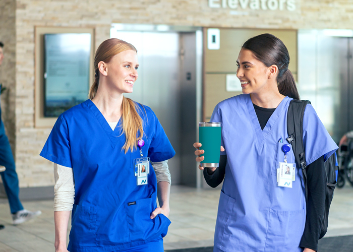 Nurses walking and talking Nurses walking and talking
